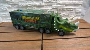 lot 150 image: Dinosaurs Coming Inertia Driving Dinosaur Storage Car with 2 Dinosaur Vehicles