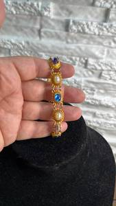 lot 188 image: Gold Tone Bracelet with Colored Cabochon Stone Links