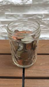 lot 201 image: Small jar full of different coins