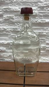 lot 282 image: Elijah Craig Bourbon Whiskey Bottle with 1789 Embossing and Red Wood & Cork Stopper