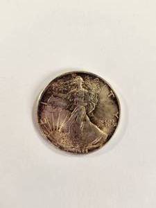 lot 104 image: 1986 American Silver Eagle 1 Oz .999 Fine Silver First Year Issue