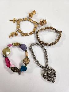 lot 226 image: Lot of 4 Fashion Bracelets Gold Silver Tone Charm Beaded Lisner Sarah Cov