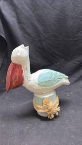 lot 220 image: Hand-Carved Wooden Bird Figurine with Painted Details and Rope Base