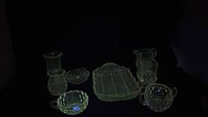 lot 306 image: Glass Tableware Lot 8 Pieces Pitcher Bowls Butter Dish - Manganese Glow under UV365nm