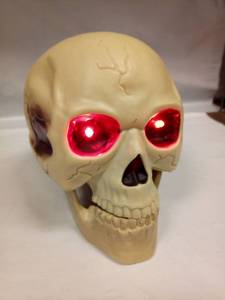 lot 1103 image: Skull Decoration with LED Light-Up Eyes and Egg-Shaped Body - Retail $24
