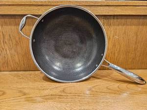lot 243 image: $167 HexClad 12 Hybrid Nonstick Wok, Dishwasher and Oven Safe, Induction-Ready  Stay-Cool Handles, Dishwasher and Oven Safe up to 900 F, Compatible with All Cooktops