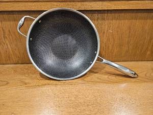 lot 246 image: $167 HexClad 12 Hybrid Nonstick Wok, Dishwasher and Oven Safe, Induction-Ready  Stay-Cool Handles, Dishwasher and Oven Safe up to 900 F, Compatible with All Cooktops