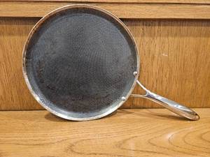 lot 249 image: $139 HexClad 12 Hybrid Nonstick Griddle Pan, BBQ, Dishwasher and Oven Safe  Stay-Cool Handles, Oven Safe up to 900 F, Compatible with All Cooktops, Induction Ready