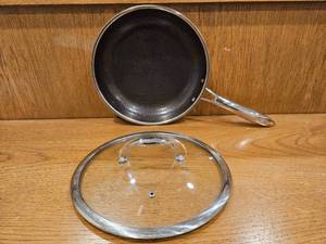 lot 251 image: $158 HexClad 10 Hybrid Nonstick Frying Pan with Lid, Dishwasher & Oven Safe  Stay-Cool Handles, Dishwasher and Oven Safe up to 900 F, Compatible with All Cooktops