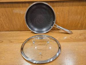 lot 253 image: $158 HexClad 10 Hybrid Nonstick Frying Pan with Lid, Dishwasher & Oven Safe  Stay-Cool Handles, Dishwasher and Oven Safe up to 900 F, Compatible with All Cooktops