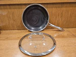 lot 256 image: $158 HexClad 10 Hybrid Nonstick Frying Pan with Lid, Dishwasher & Oven Safe  Stay-Cool Handles, Dishwasher and Oven Safe up to 900 F, Compatible with All Cooktops