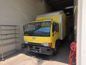 lot 2207 image: 2007 Nissan UD1400 Box Truck w Shelving  Diesel  Does Not Start  Title