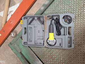 lot 7022 image: Ryobi Corded Angle Grinder with Accessories Kit