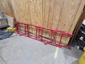 lot 7163 image: Red Steel Hay Bale Rack  Feeder