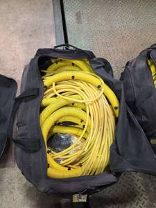 lot 7380 image: Drealz Heavy-Duty Electrical Cord Storage Bag with Yellow Cable