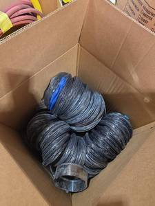 lot 7390 image: Coil of Black Electrical Wire with Blue Tape Marker