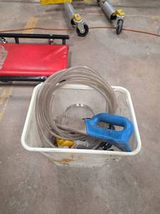 lot 7642 image: Coiled Clear Tubing w Blue Handle & Clamps