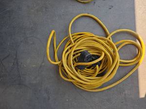 lot 7697 image: Yellow Extension Cord with Black Plug