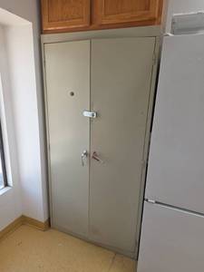 lot 7764 image: 2-Door Metal Storage Cabinet w Adjustable Shelves