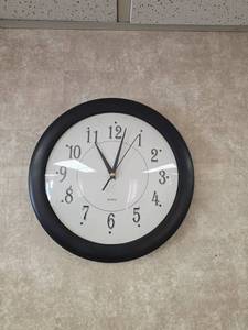 lot 7900 image: Quartz Wall Clock with Black Frame