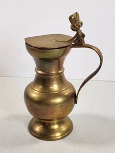 lot 118 image: Brass Pitcher with Flip Lid and Figural Handle
