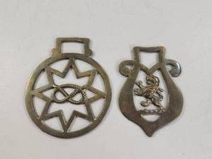 lot 124 image: Lot of 2 Metal Horse Bridle Ornaments with Star and Lion Designs