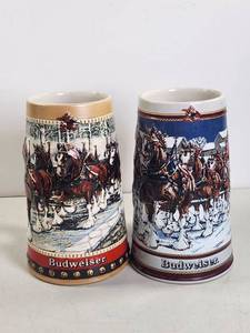 lot 203 image: Budweiser Anheuser-Busch Ceramic Beer Steins Holiday Horse Team Set of 2