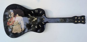 lot 1002 image: Guitar-Shaped Wooden Wall Clock with Elvis Presley Photo - 36 in long