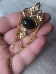 lot 6301 image: Ornamental Pendant with Black Oval Stone and Chain