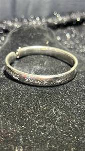 lot 12 image: Sterling Silver Hinged Bangle Bracelet with Engraved Floral Design