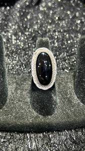 lot 17 image: Sterling Silver Ring with Black Oval Stone and Decorative Beaded Setting