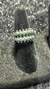 lot 24 image: Ring with Green Stones and Beaded Metal Design