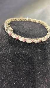 lot 93 image: Stamped .925 Decorative Bracelet with Pink and Clear Stones