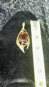 lot 100 image: 1960s-1970s Vintage Sarah Coventry Molten Topaz Pendent Large featuring a Amber colored stone