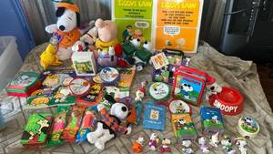 lot 27 image: Peanuts Snoopy Character Collection Lot Plushes Books and pez