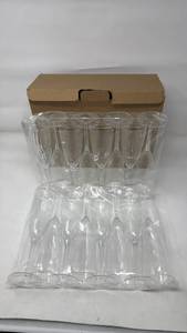 lot 162 image: Set of 16 Clear Glass Champagne Flutes with Ribbed Design - Retail $0