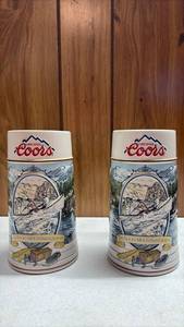 lot 281 image: Coors Original The Rocky Mountain Legend Beer Steins Pair