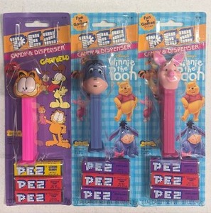 lot 206 image: PEZ Candy Dispenser Lot Garfield Winnie the Pooh Piglet 3 Pack