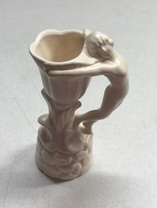 lot 224 image: cream-glazed ceramic bud vase features an art deco figural handle and a textured floral base, characteristic of mid-20th-century American art pottery producers like McCoy or Shawnee