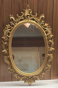 lot 250 image: Ornate Oval Mirror with Scrolled Frame