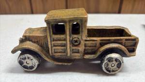 lot 112 image: Cast Iron Pickup Truck Toy with Mustard Color Body and Silver Tone Wheels