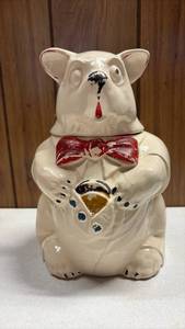 lot 155 image: 1940s McCoy ceramic bear cookie jar featuring a white glazed body, a red bow tie, cookie and vest detail