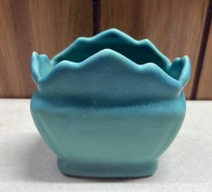 lot 181 image: Vintage Van Briggle art pottery tulip bowl or scalloped vase featuring a distinctive matte turquoise (or Ming blue) glaze and a wave-like, scalloped rim.