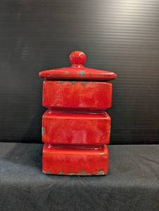 lot 166 image: Red distressed look storage jar