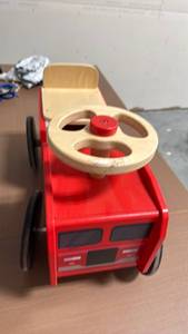 lot 46 image: Red Ride-On Toy Truck with Wooden Steering Wheel and Seat - Retail $0