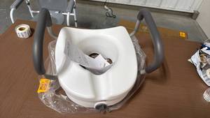 lot 59 image: Raised Toilet Seat with Armrests - Retail $0