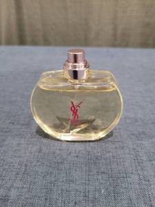 lot 1546 image: Yves Saint Laurent Fragrance Spray Bottle Partial Bottle
