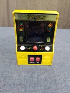 lot 1583 image: Pac-Man Handheld Electronic Game