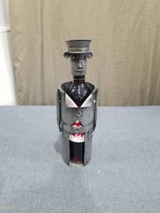 lot 1596 image: Metal Figural Wine Bottle Holder with Anthropomorphic Head and Hat Wine Bottle Not Included