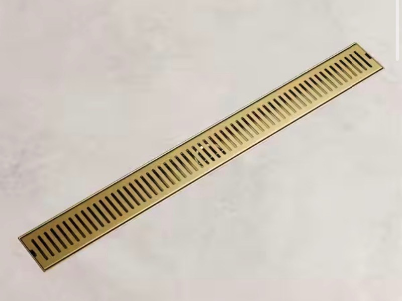 lot 191 image: 24 in Linear Shower Drain in Matte Brushed Gold Retails $99